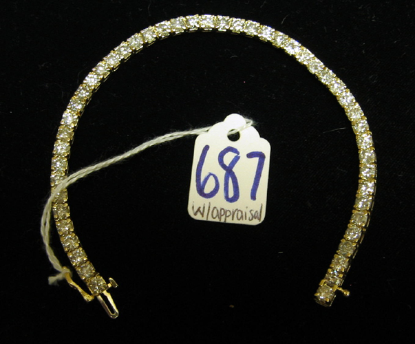 Appraisal: DIAMOND AND FOURTEEN KARAT GOLD TENNIS BRACELET WITH APPRAISAL The