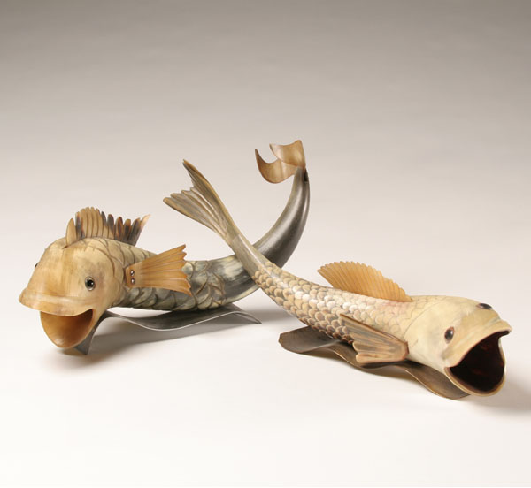 Appraisal: Vintage carved horn fish one with inserted fins one with