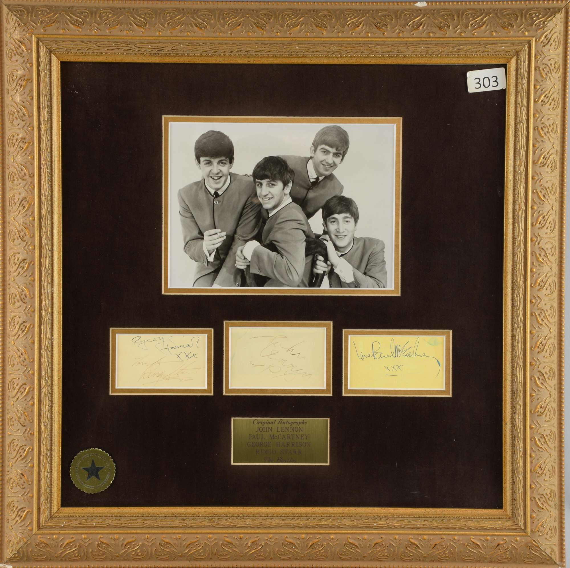 Appraisal: The Beatles a framed display with two signed autograph pages