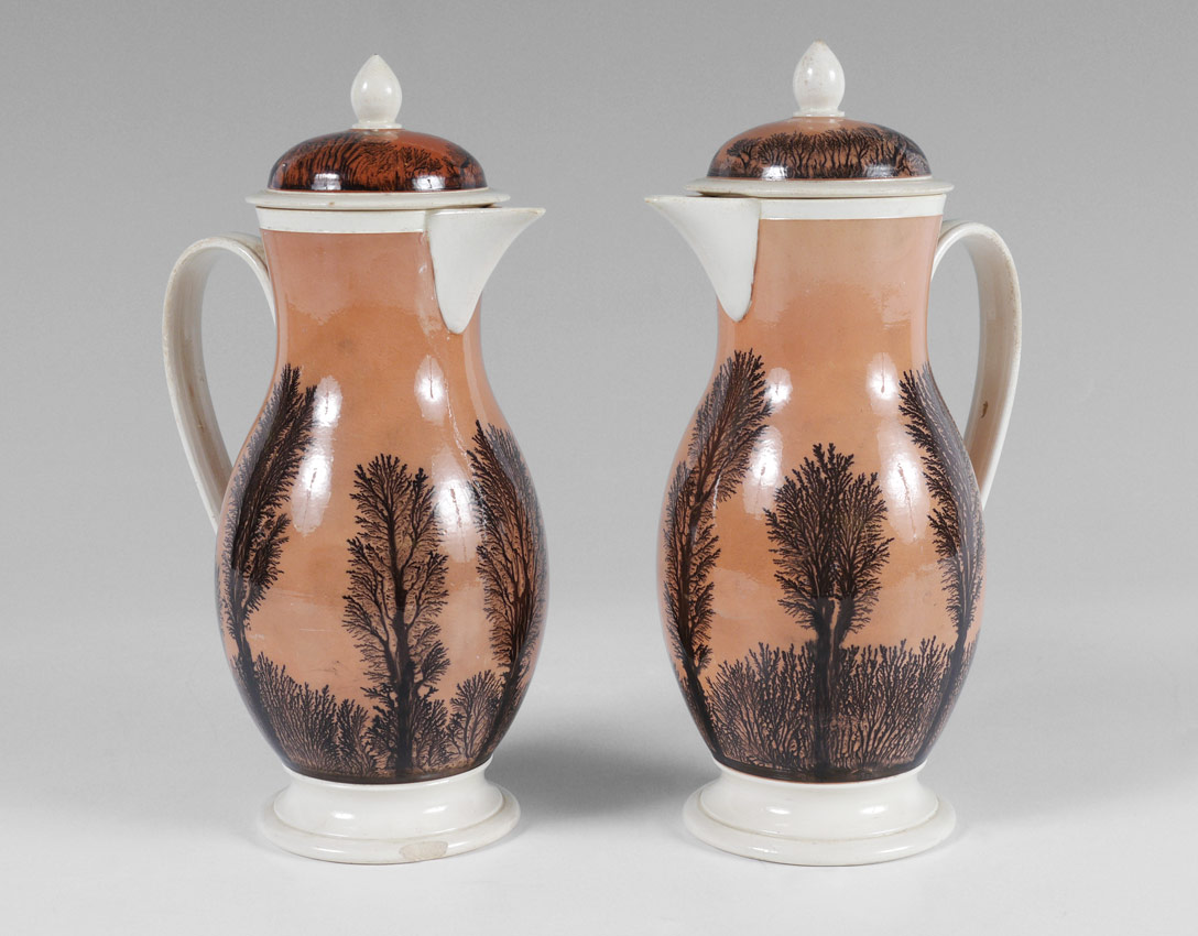 Appraisal: SARREGUEMINES MOCHA WARE PITCHERS DECORATED IN THE SEAWEED PATTERN Each