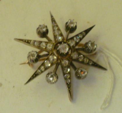 Appraisal: A VICTORIAN DIAMOND STAR BROOCH set with round rose-cut diamonds