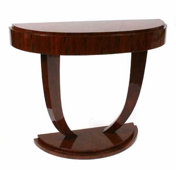 Appraisal: A pair of Art Deco style mahogany demilune console tables