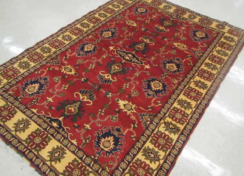 Appraisal: HAND KNOTTED ORIENTAL CARPET Pakistani Persian tribal stylized floral decoration