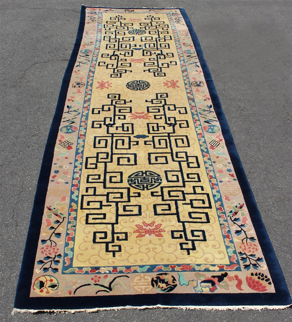 Appraisal: LARGE CHINESE WOOL RUG RUNNER fretwork and floral design colors