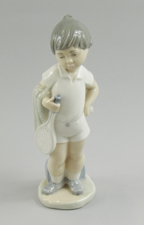 Appraisal: A Lladro porcelain figure of a young tennis player gold