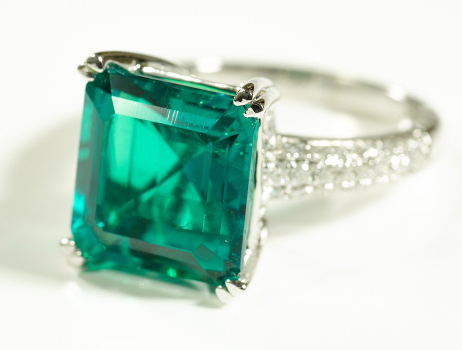 Appraisal: CHATHAM EMERALD AND DIAMOND RING k white gold with round-cut