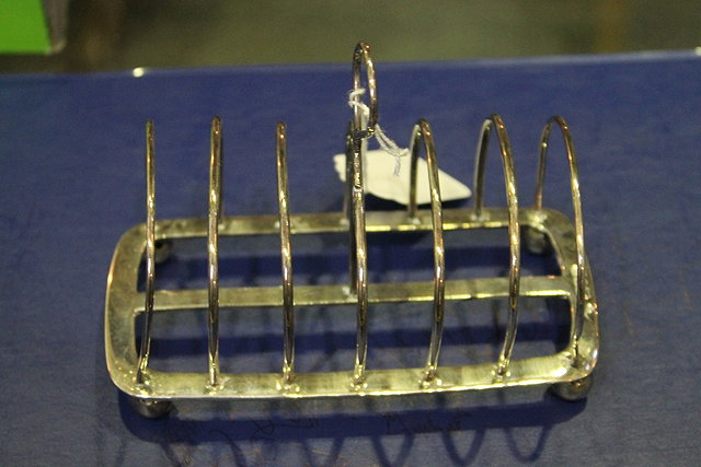 Appraisal: A SILVER SIX DIVISIONAL TOAST RACK of plain form on