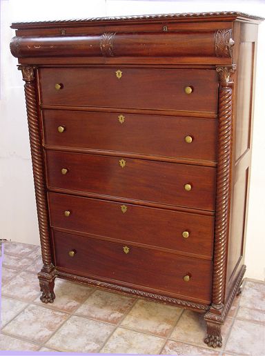 Appraisal: EMPIRE PERIOD MAHOGANY TALL CHEST Featuring spiral carved full columns