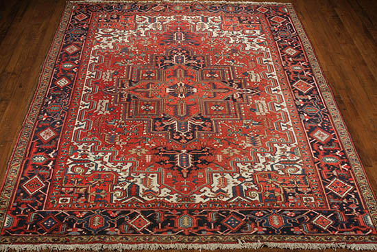 Appraisal: Heriz Rug Post Red ground with herati field enclosing a