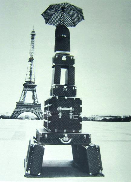 Appraisal: EIFFEL TOWER WITH LUGGAGE UMBRELLA FRAMED PRINT EIFFEL TOWER WITH