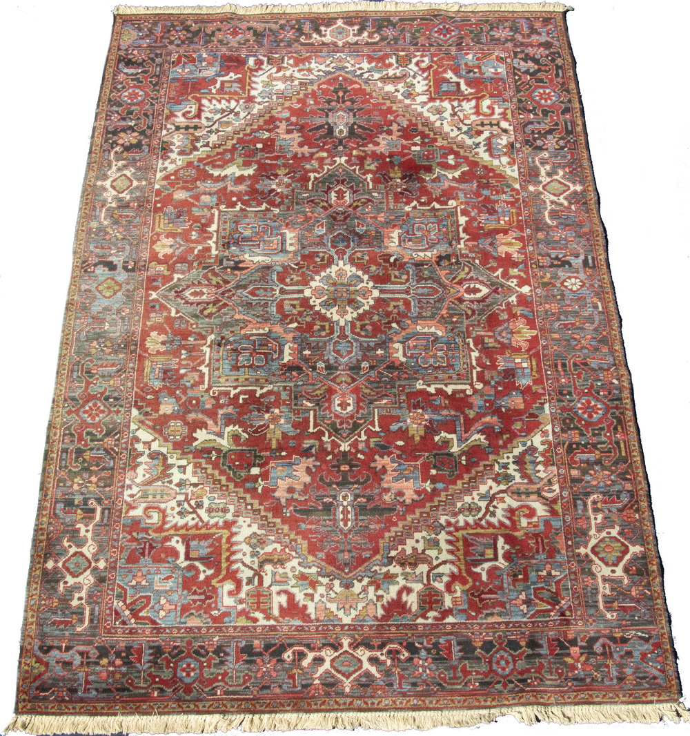 Appraisal: MACHINE MADE BELGIAN HERIZ STYLE CARPET Large gabled square medallion