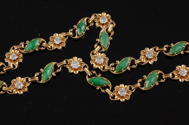 Appraisal: A JADEITE AND DIAMOND NECKLACE Set with carved jadeite panels