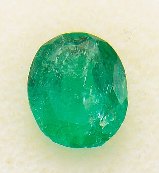 Appraisal: An unmounted emerald the oval-shaped emerald weighing cts