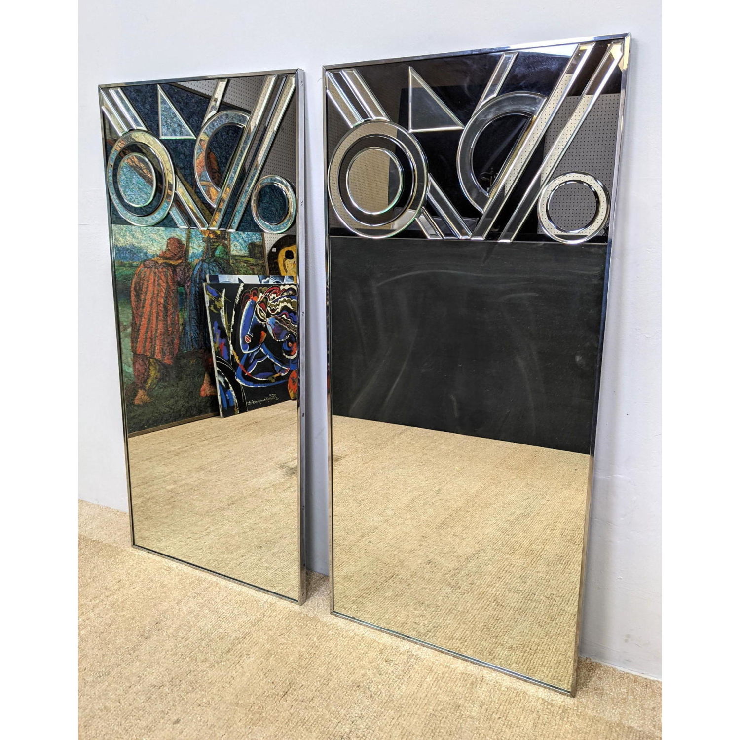 Appraisal: Pr Mirrored Glass Decorative Panels Each with applied geometric beveled