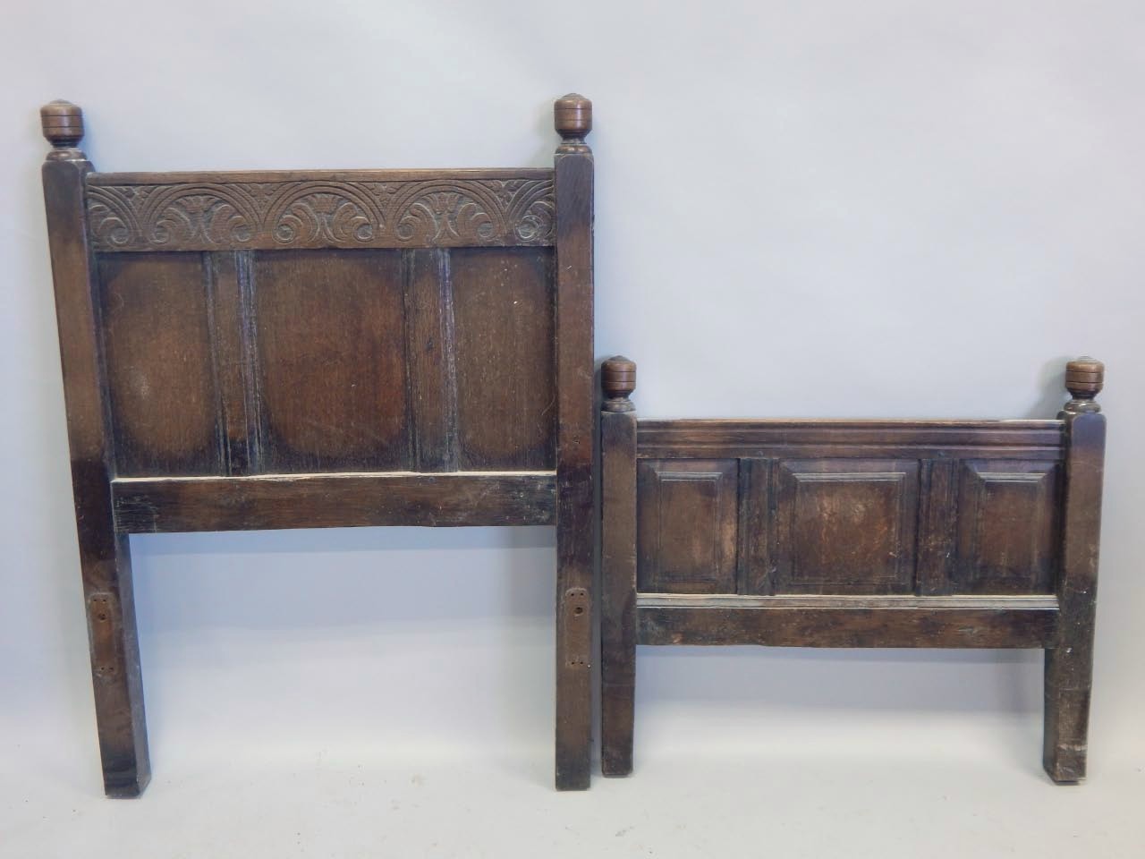 Appraisal: A panelled oak single bed head and foot with turned