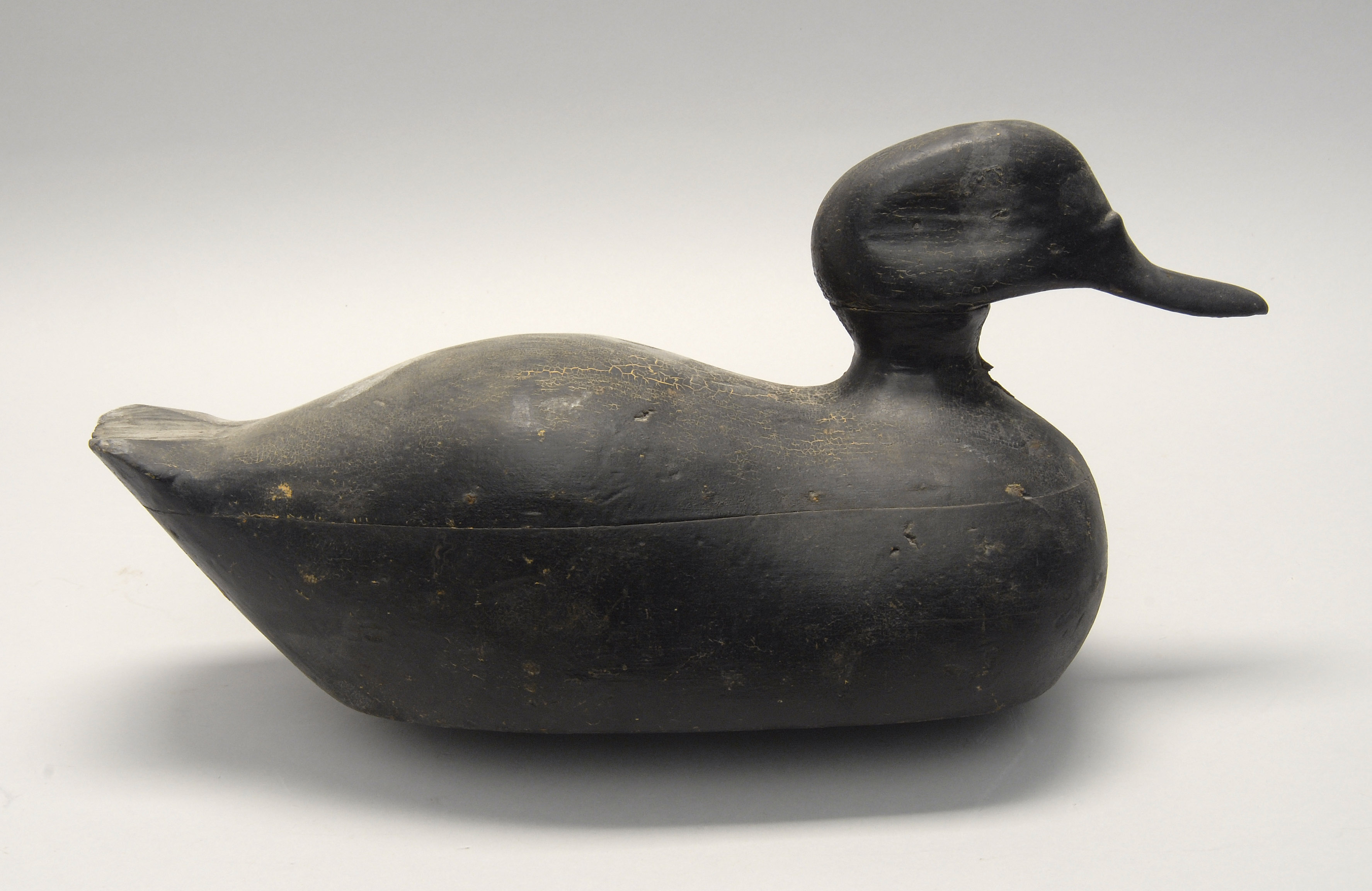 Appraisal: FOLKSY BLACK DUCK DECOY Maker unknown Hollow-carved Old in-use repaint