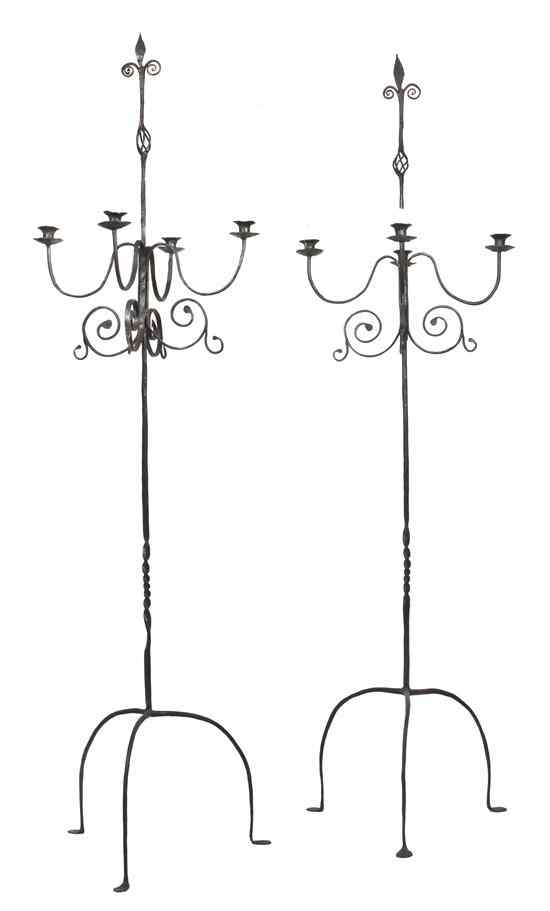 Appraisal: A Pair of Wrought Iron Four-Light Torchieres with stylized foliate