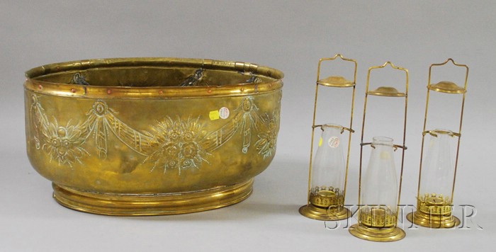 Appraisal: Oval Repousse Brass Foot Tub and a Set of Three