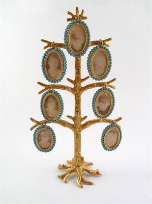 Appraisal: A gilt metal stylised family tree with seven detachable glazed