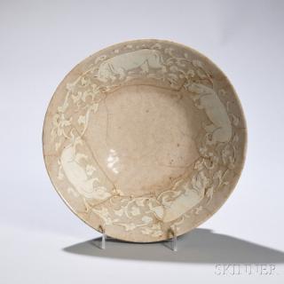 Appraisal: Large Beige-glazed Bowl with Hippopotamuses Large Beige-glazed Bowl with Hippopotamuses