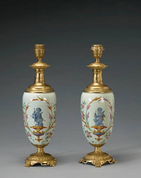 Appraisal: A pair of French gilt bronze mounted porcelain oil lamps