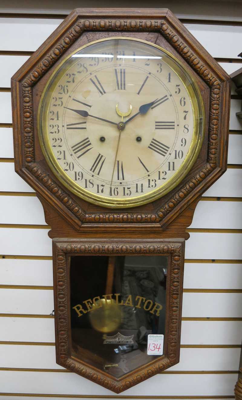 Appraisal: TWO WATERBURY 'REGULATOR' WALL CLOCKS Stork model store regulator circa