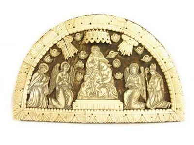 Appraisal: An Indo-Portugese carved bone arched panel depicting the Holy Family