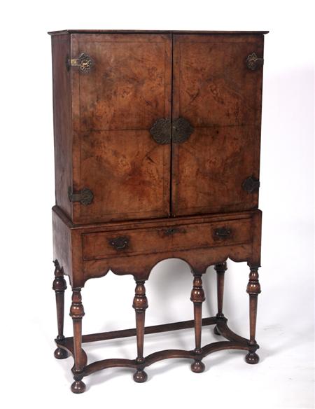 Appraisal: A Queen Anne style walnut cabinet on stand the projected