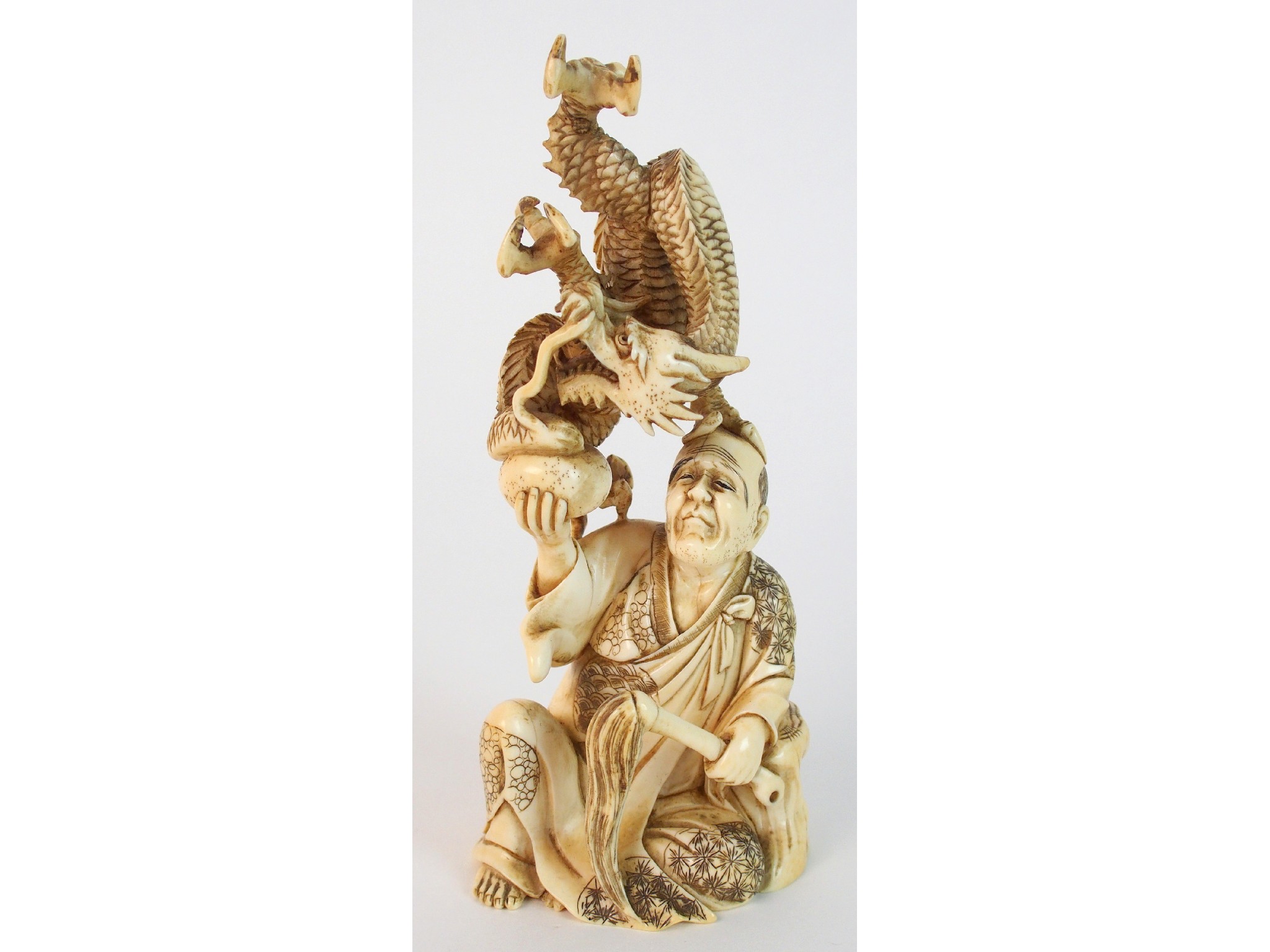 Appraisal: A Japanese ivory okimono of a dragonemerging from its egg