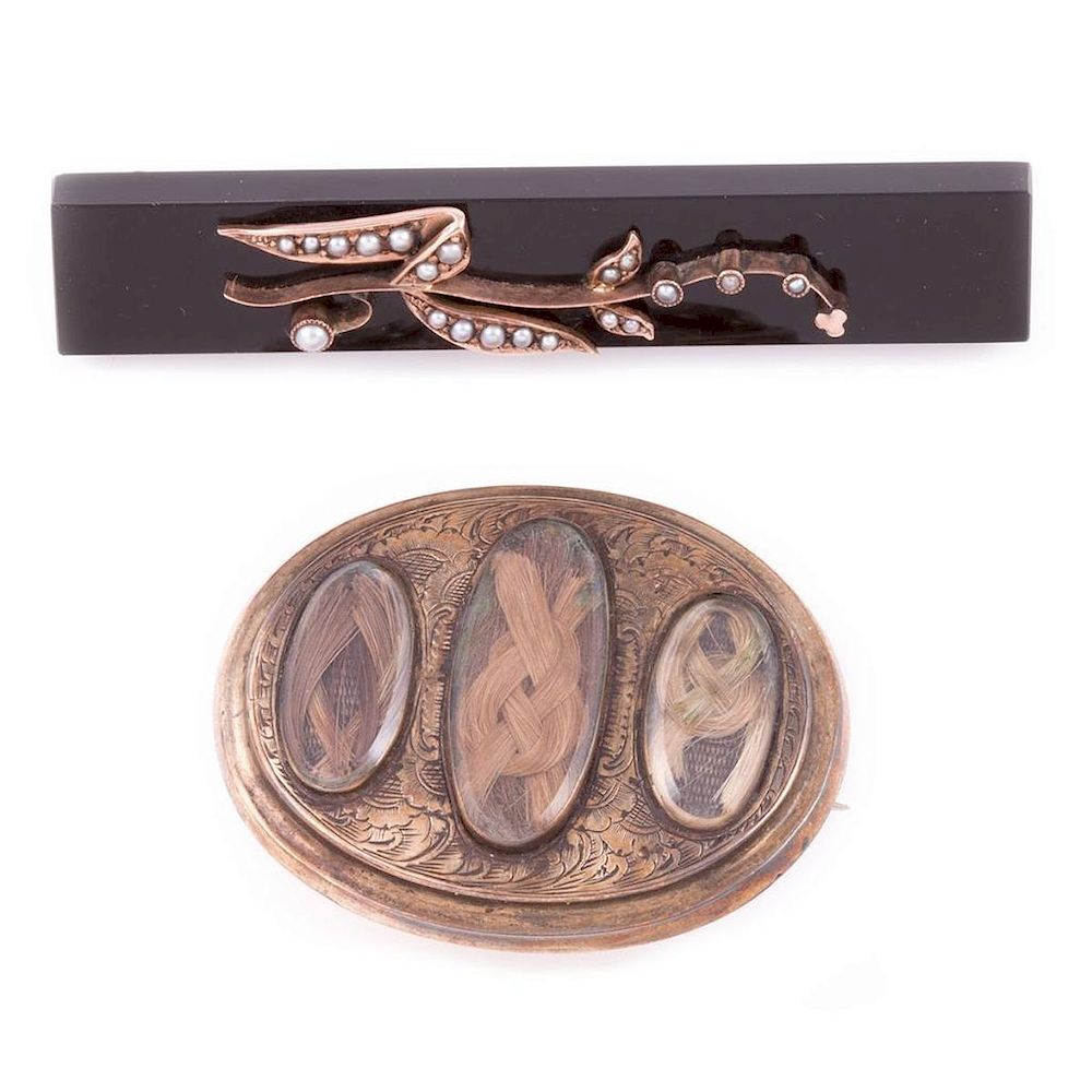 Appraisal: Two Victorian mourning brooches k gold and gold-filled with onyx