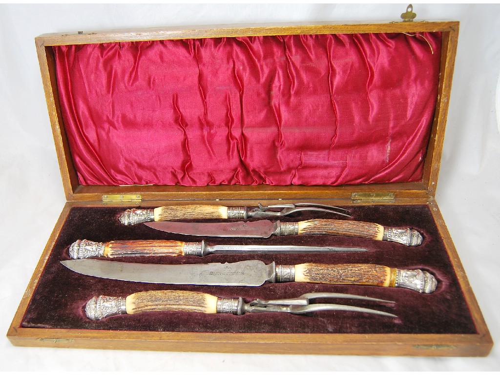 Appraisal: Oak cased set of game and meat carvers to w