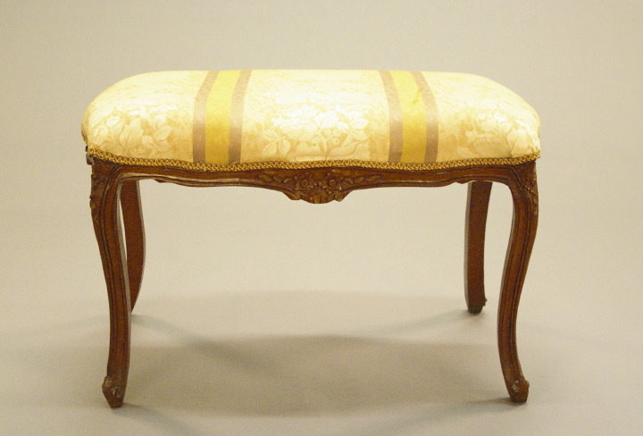 Appraisal: Provincial Louis XV-Style Fruitwood Stool the padded and shaped rectangular