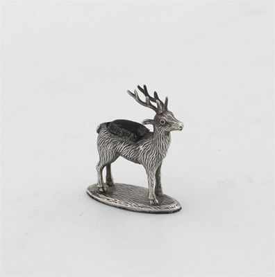 Appraisal: A standing stag pin cushion with long antlers on an