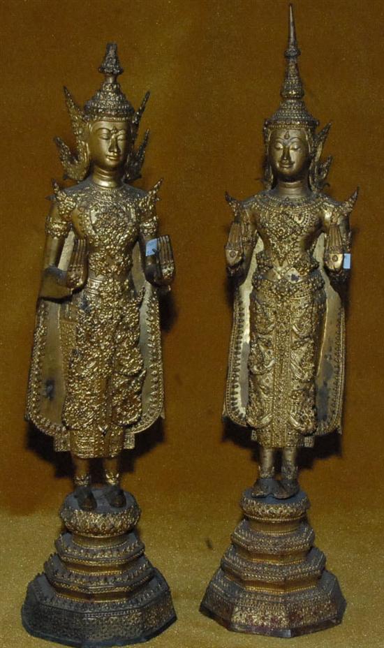 Appraisal: PAIR GILT BRONZE STANDING BUDDHAS One having a loss to