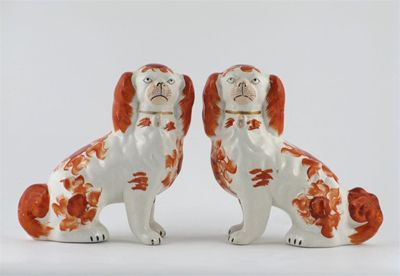 Appraisal: A pair of Staffordshire spaniels painted in iron red with