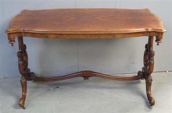 Appraisal: th Century walnut centre table with shaped top on twin