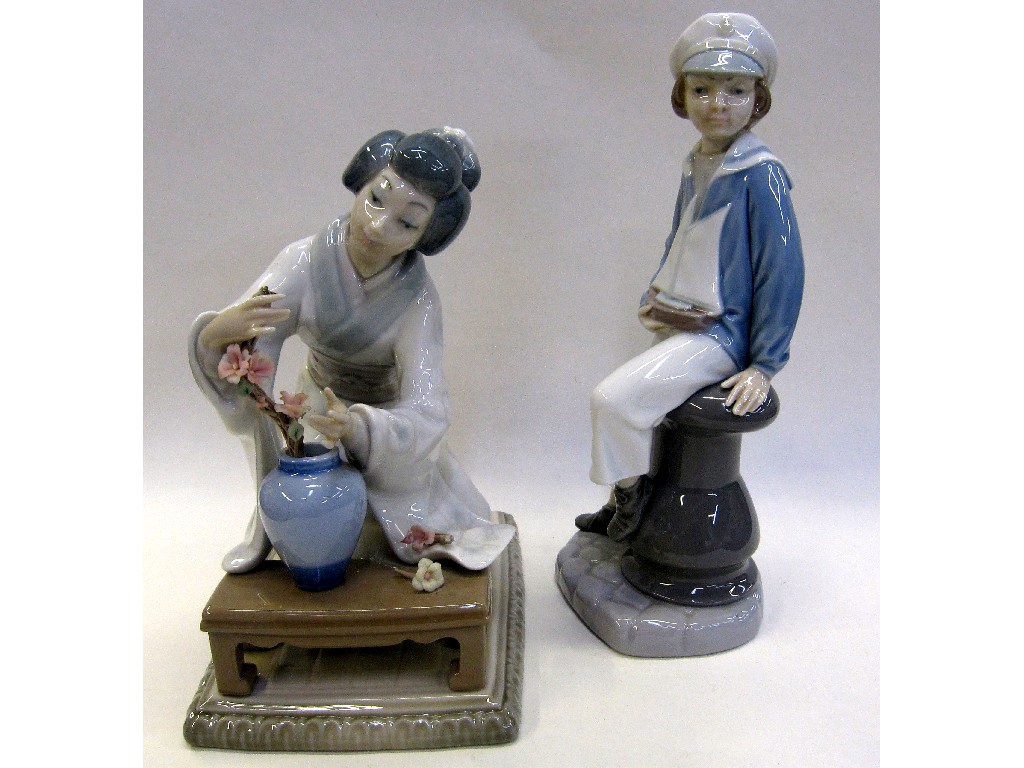 Appraisal: Lladro figure of a Geisha and another of a boy