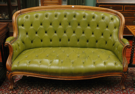 Appraisal: A LOUIS XV STYLE BUTTONED LEATHER UPHOLSTERED SETTEE