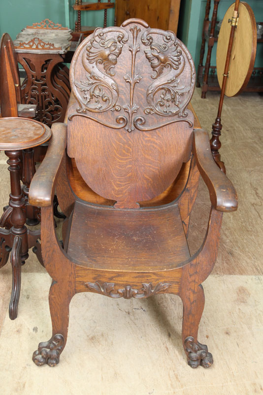 Appraisal: OAK ARMCHAIR Pressed back chair with double dragon heads and