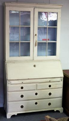 Appraisal: A painted bureau bookcase the upper section enclosed by glazed