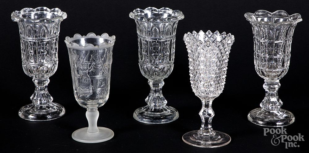 Appraisal: Five colorless glass vases Five colorless glass vases h Condition