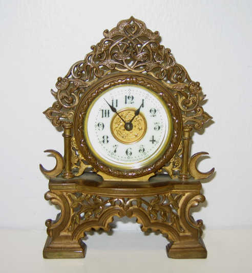 Appraisal: ANSONIA GILT-METAL DESK CLOCK Pierced vanity form frame circular signed