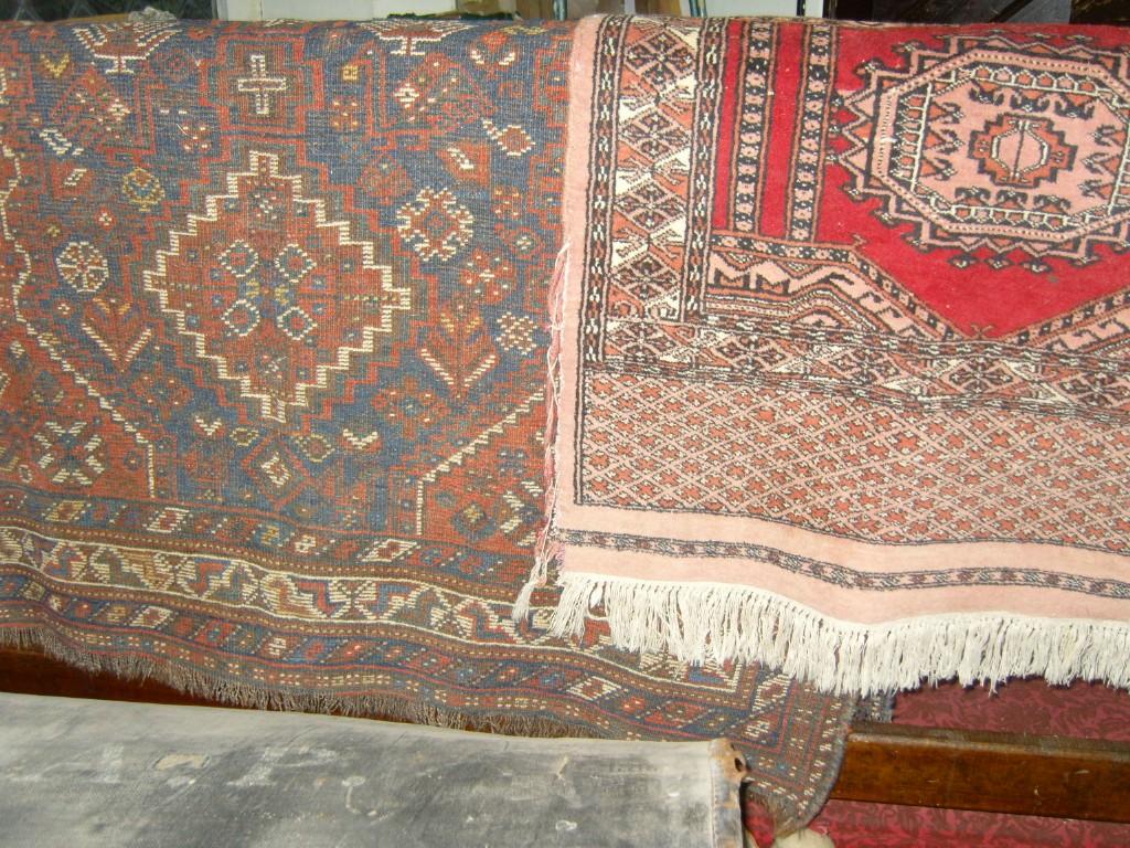 Appraisal: A red ground eastern wool rug with stylised floral decoration