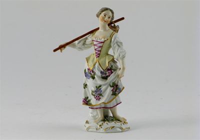 Appraisal: A Meissen figure of a girl standing barefoot and holding