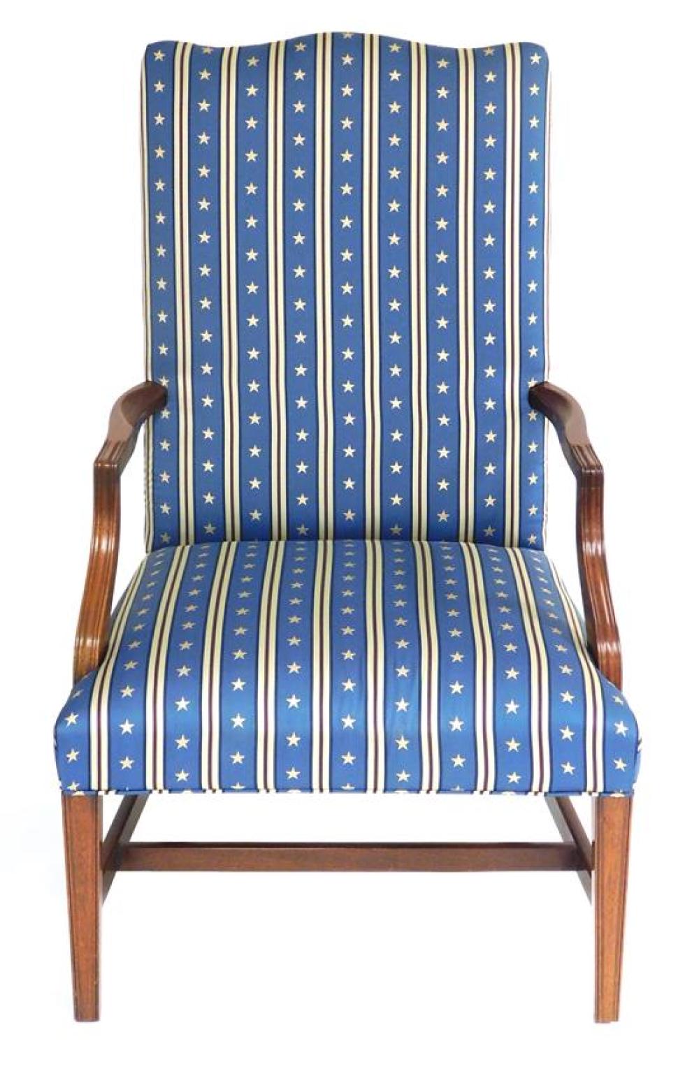 Appraisal: Lolling armchair with red white and blue striped upholstery with