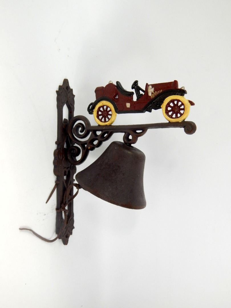 Appraisal: A vintage motor car mounted bell on a wall bracket