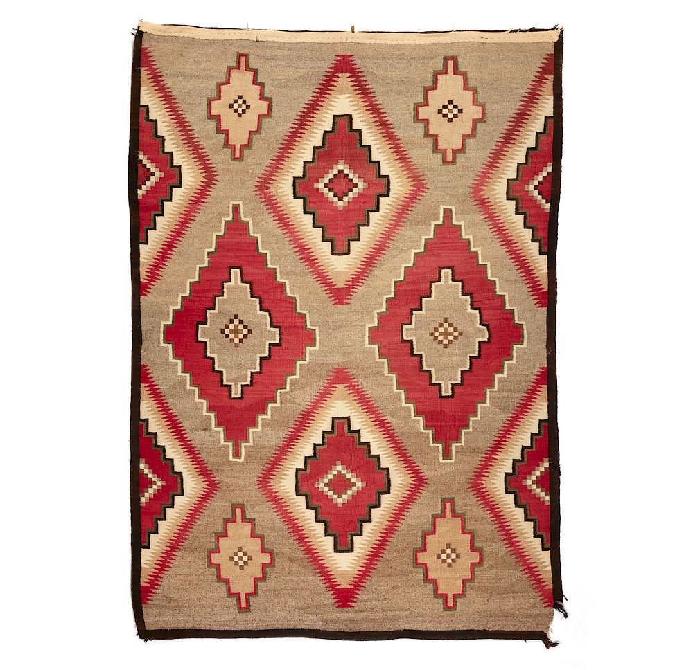 Appraisal: Navajo Rug Navajo rug in red and brown on taupe