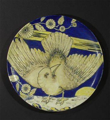 Appraisal: An Arts and Crafts earthenware charger painted with a bird