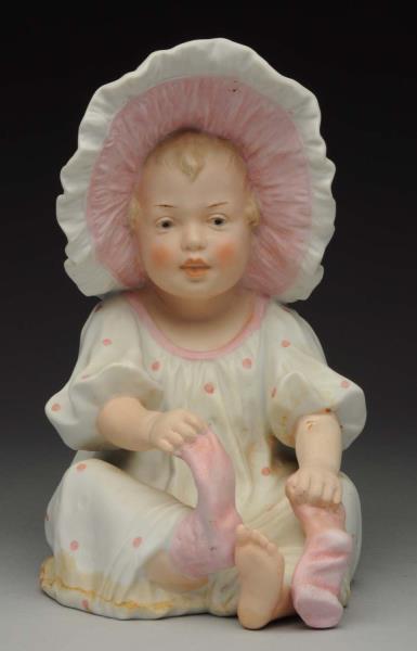 Appraisal: Sweet Gebr Heubach Sunbonnet Girl Sitting little girl in pink