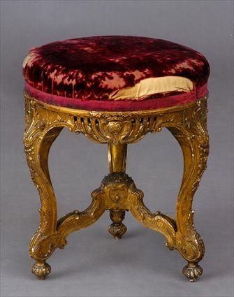 Appraisal: REGENCY-STYLE CARVED GILTWOOD TABOURET The circular maroon velvet seat above